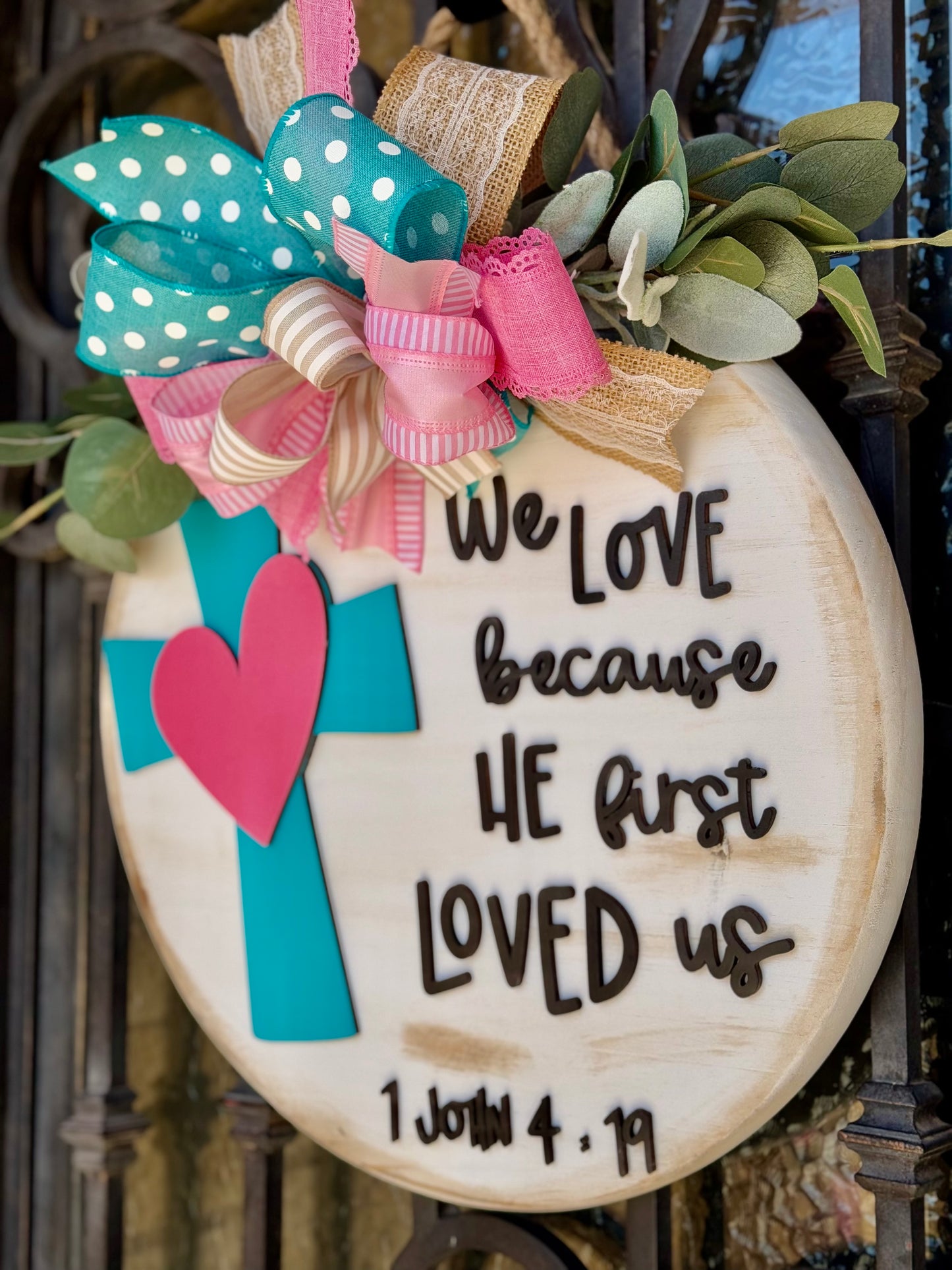 We love because he first loved us Sign