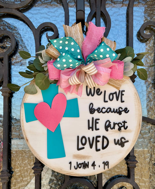 We love because he first loved us Sign